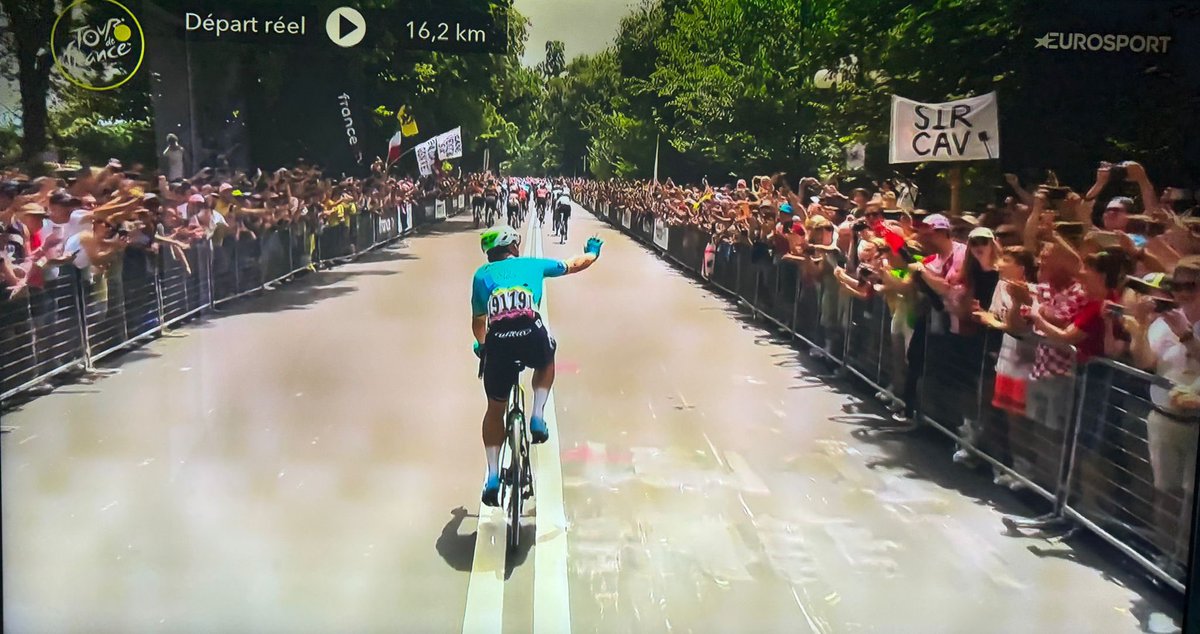 ChrisRason's tweet photo. @CyclingAlmanack @nedboulting @MarkCavendish I’m holding the ‘Sir Cav’ banner at the Grand Depart in Florence, what a day. Favourite win? Had to be #35 because after 2023 we didn’t think it was possible and the craftsmanship in the wheels was masterful and I saw him on the limit on the slopes of the Galibier. Top man! https://t.co/5XNtRHduos