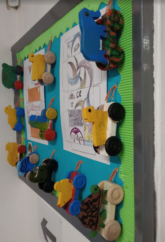 Year 7 have been very busy in their Art and DT lessons this term and the Hall display is full of cow, chicken, fish, tiger and tortoise pull-along toys and abstract 'Me, Myself and I' artworks.