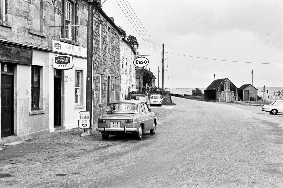 HighlandHistory's tweet photo. High Street, #Avoch, late-1960s. The Narobi Cafe had been opened by James Sutherland citrca 1965. He had spent 40 years working in Nairobi as a painter and decorator before returning home to Avoch

[photo: Ken MacKenzie / @HighlandCouncil] https://t.co/gvt80EMMmJ