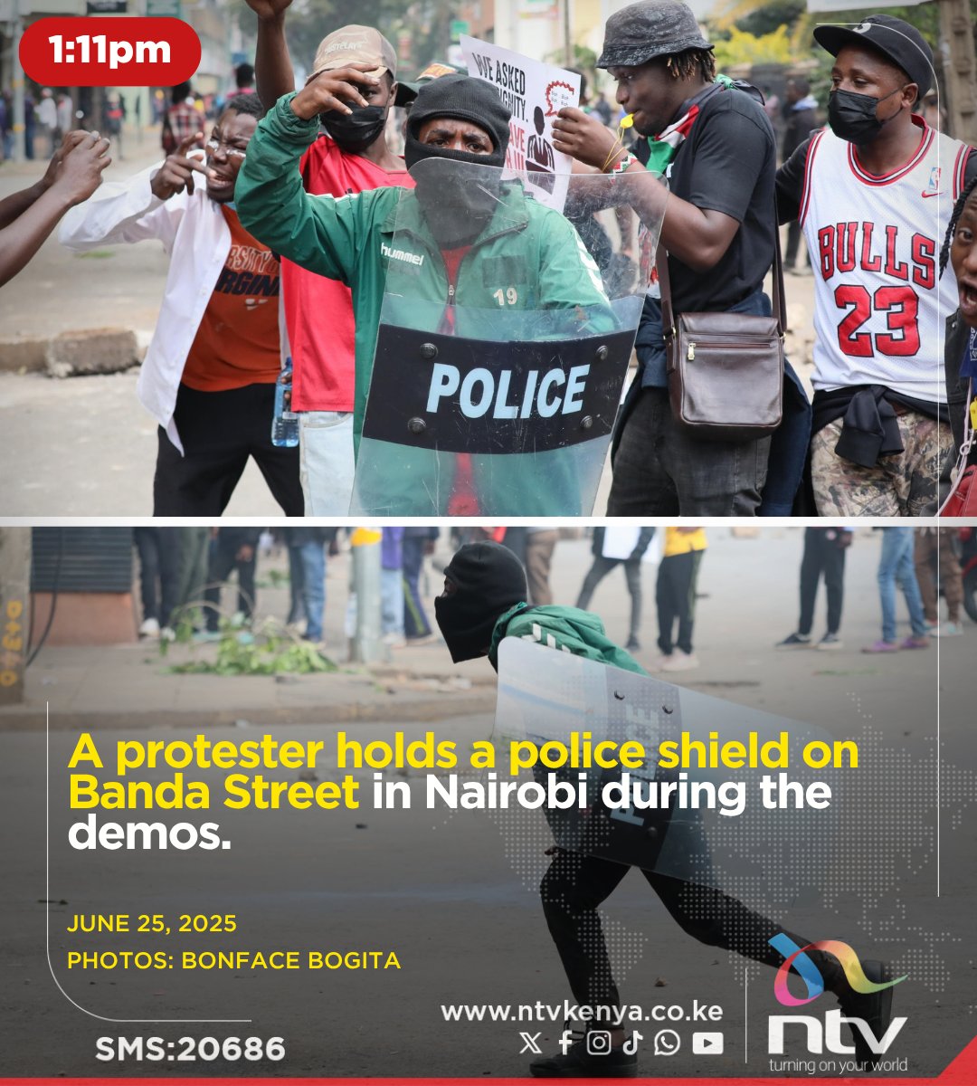 A protester holds a police shield on Banda Street in Nairobi during the demos.