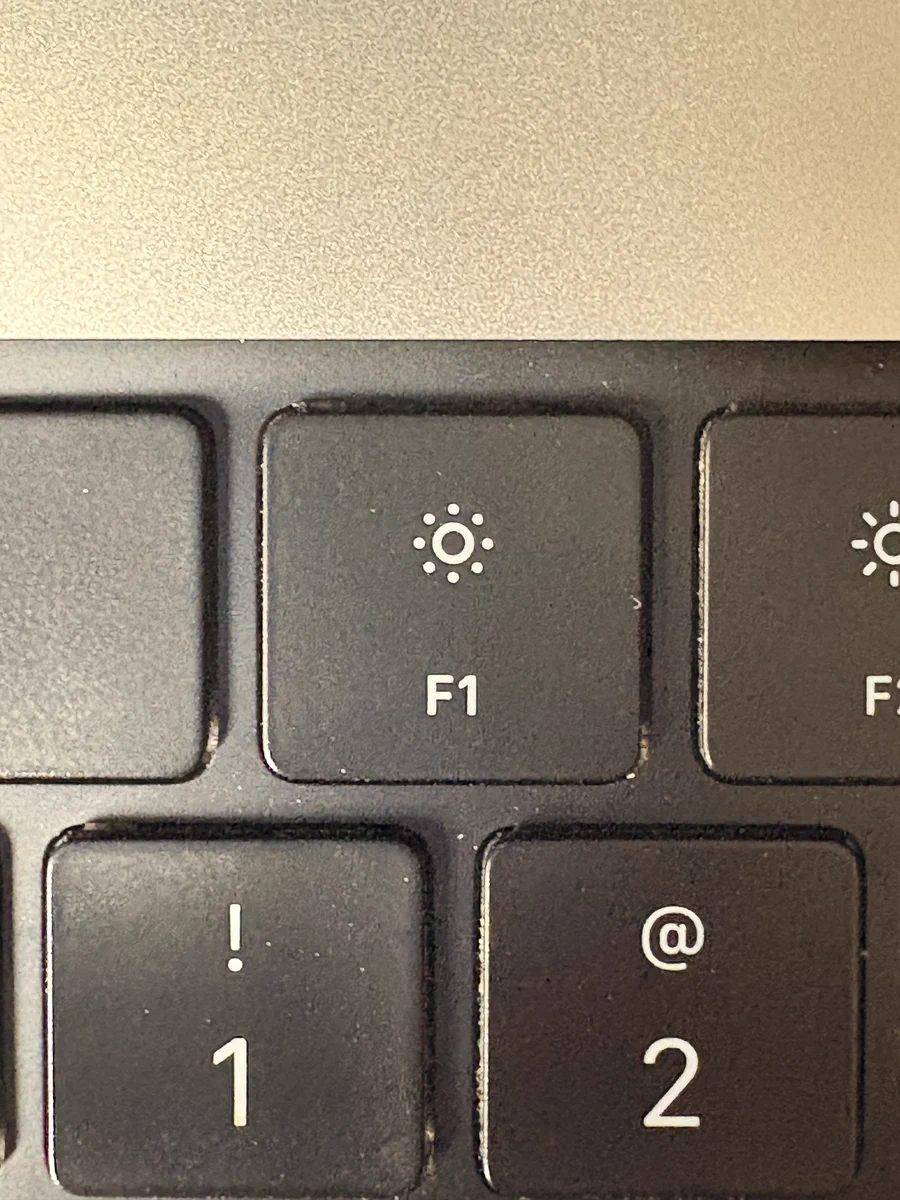 F1 key on a MacBook keyboard