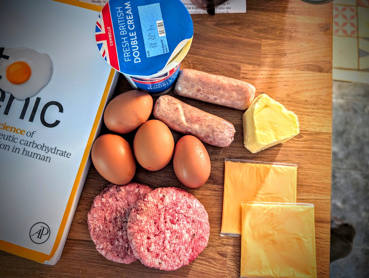 You don't need grass fed meat or eggs from chickens that get massages.

Standard supermarket products work just fine. 

I feed myself for £3 ($4) daily eating this way. Goes up if I add more protein.