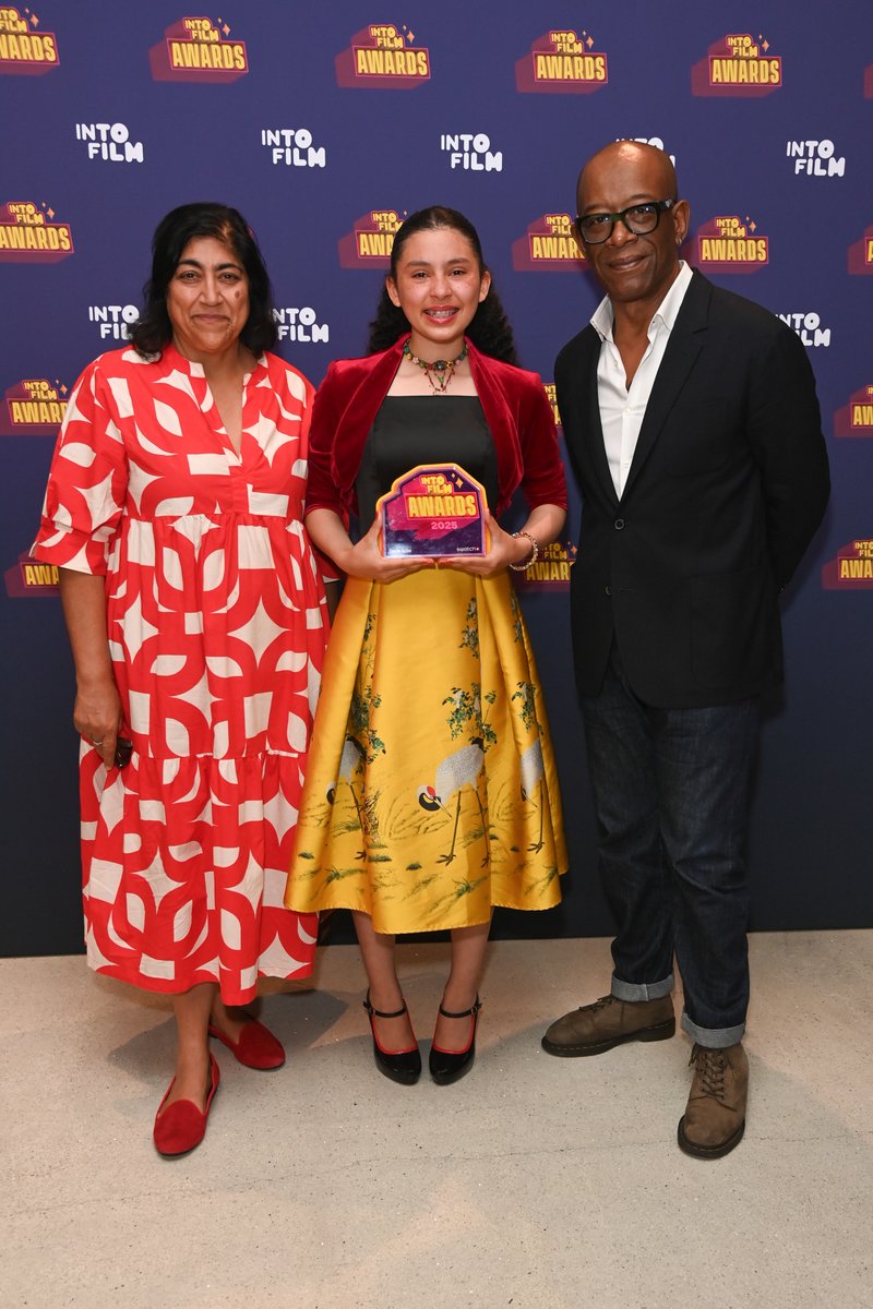 Congratulations to Araminta, aged 16, from Conwy in Wales whose film 'Tipping Point' has won Time For Action (sponsored by Swatch) at the 2025 #IntoFilmAwards. 🏆 <a href="/Swatch/">Swatch</a> bit.ly/3TEY6WN

Pictured with award presenters Gurinder Chadha and Lennie James.