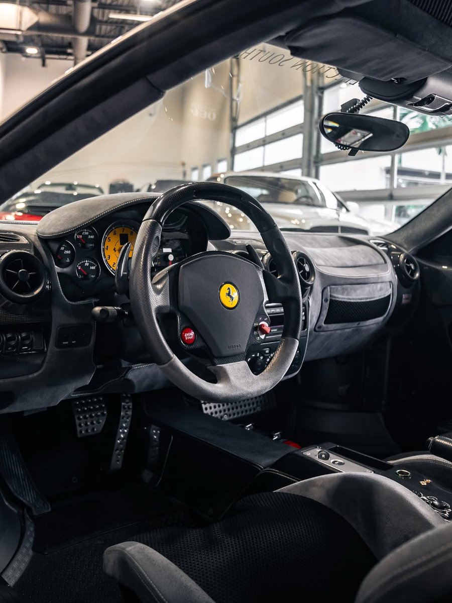 2008 Ferrari 430 Scuderia shown in Avus White with a Grey / Black interior plus tons of Carbon Fiber accents scattered throughout!