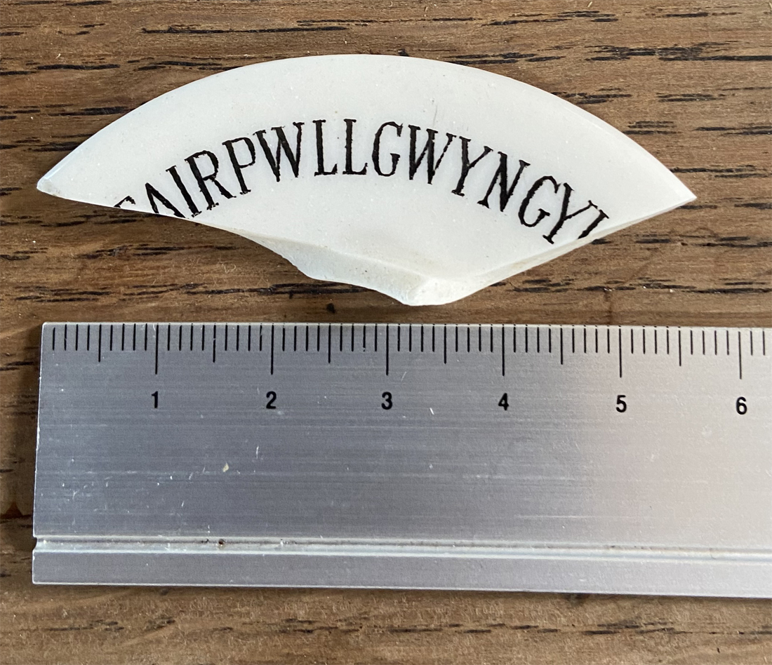 BasedInChurton's tweet image. I haven't dug anything interesting out of the garden for an absolute age, but thought this worth a mention just for fun. Unlike the gollywog sherd, which took me a moment to work out, it was perfectly obvious that this was a souvenir from Llanfair PG! wp.me/pcZwQK-7LN
