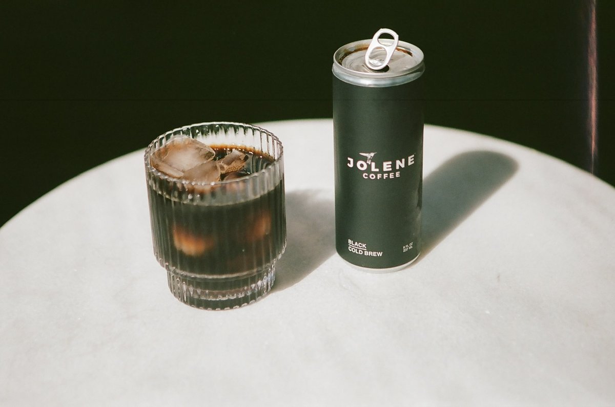 BeverageDigest's tweet image. Red Hot Chili Peppers lead singer Anthony Kiedis and his longtime friend Shane Powers have launched a ready-to-drink canned cold brew coffee called Jolene. Flavors are Black and White, the latter of which contains oat milk. 

#redhotchilipeppers #cannedcoffee #coldbrew #oatmilk