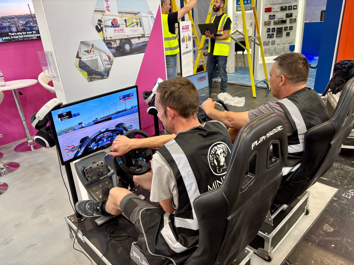 Just finished this stunner at the #installershow for  good friends A-Gas complete with race car simulators. Of course, the build crew had to give them a quick test, didn't they?! Pop over to stand 5/E60 and test your driving skills! #standdesign #tradeshowstand #dodgydriving