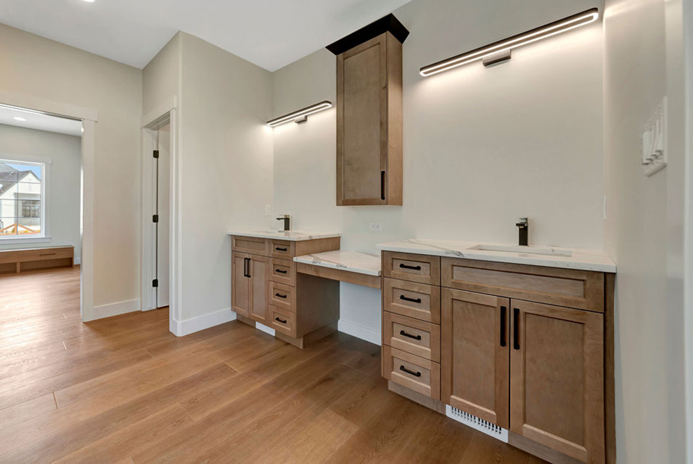 This stunning kitchen features the Ocean door style in White Maple with custom stained and painted components. This kitchen take two tone style to a whole new level with contrasting crown molding, vent hood and island parts. Thanks for the beautiful pictures <a href="/BexsonHomes/">Bexson Homes</a>