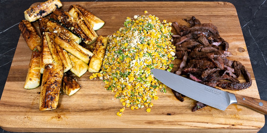 During the Summer of Flavor, beat the heat and cook up a delicious spread like this inside. Juicy stake, flavorful street corn, and perfectly grilled zucchini is all possible thanks to the unique properties of Swiss Diamond cookware. #swissdiamond #summerofflavor