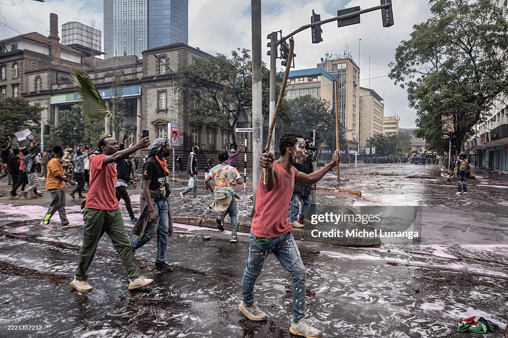 GettyImagesNews's tweet photo. A protester walks into tear gas during the Gen Z protest in Nairobi, #Kenya. Demonstration marks the first anniversary of the 2024 anti-government protests against the Finance Bill that left more than 60 people dead. 📷: Michel Lunanga #KenyaProtests https://t.co/aYrnKDHAZu