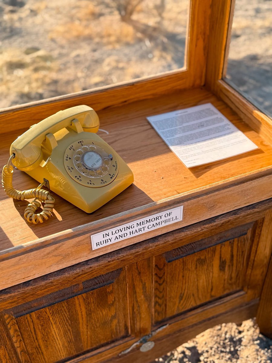 Hat tip: Maggie Downs

Today I drove out to Joshua Tree to visit a phone booth with no earthly connection.

It’s called a Wind Phone. No dial tone. No service. Just a rotary phone wired to nothing — and somehow, to everything. It was built here by Colin Campbell and Gail Lerner