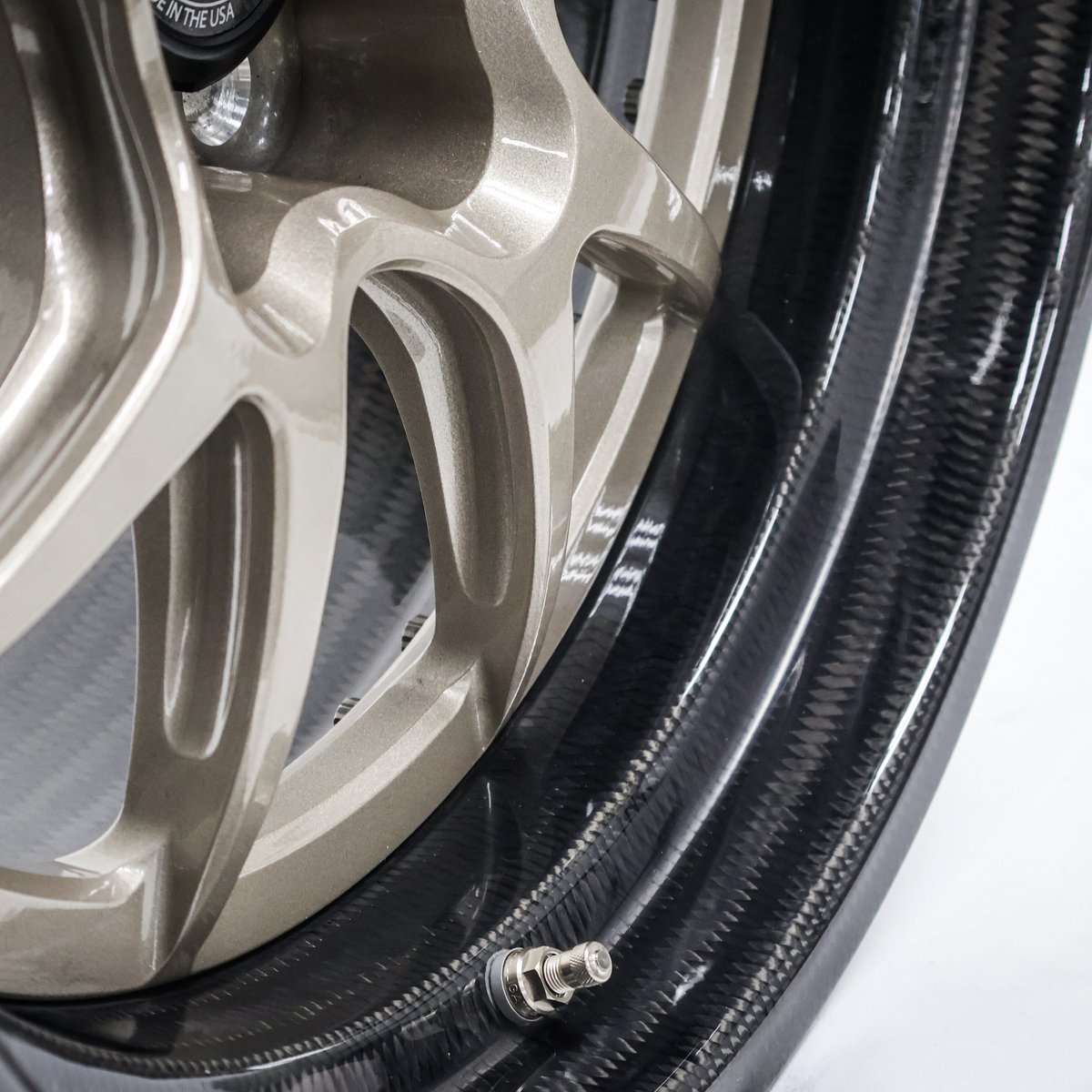 Strong + Lightweight = Fast! This set of 18x11/18x12 #Forgeline #CarbonForged #GACarbon #OpenLug wheels finished with Hampton Gold centers, real #carbonfiber barrels, and the new Carbon Fiber Open Lug Hex Center Cap was made for Forgeline's 1970 FN Camaro. In combination with the