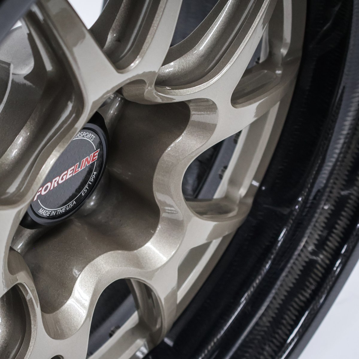 ForgelineWheels's tweet photo. Strong + Lightweight = Fast! This set of 18x11/18x12 #Forgeline #CarbonForged #GACarbon #OpenLug wheels finished with Hampton Gold centers, real #carbonfiber barrels, and the new Carbon Fiber Open Lug Hex Center Cap was made for Forgeline's 1970 FN Camaro. In combination with the new @HoosierTire Track Attack tire, we realized a significant reduction in rotating mass which translated to a noticeable improvement to vehicle handling and performance. Learn more about the GA-Carbon Open Lug (including sizes and pricing) at: https://t.co/982TEZ25Jv