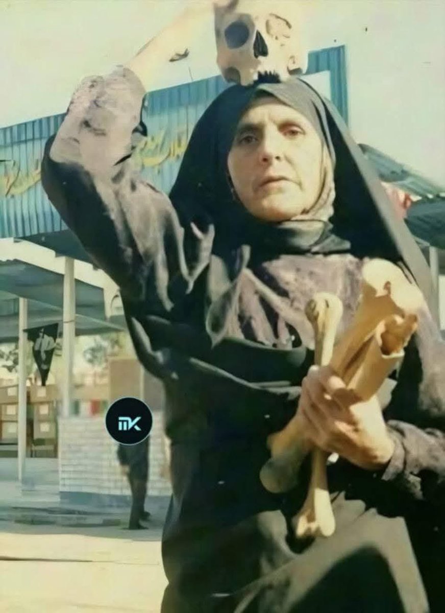 MQadiragha's tweet photo. A Kurdish women takes the bones of his son back to kurdistan after Iranian terrorist killed his son and his the body from her for years , she had to pay just to show her the grave of her son 
We won’t forget 
Iran is terrorist anyone identify as Iranian is terrorist no exception https://t.co/6h4BoH8wPf