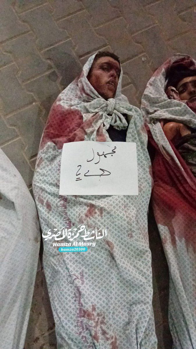 MosabAbuToha's tweet photo. Unidentified people who Israel killed in the past hours. The bodies are at the Shifa Hospital. https://t.co/2MoG7mjGJv
