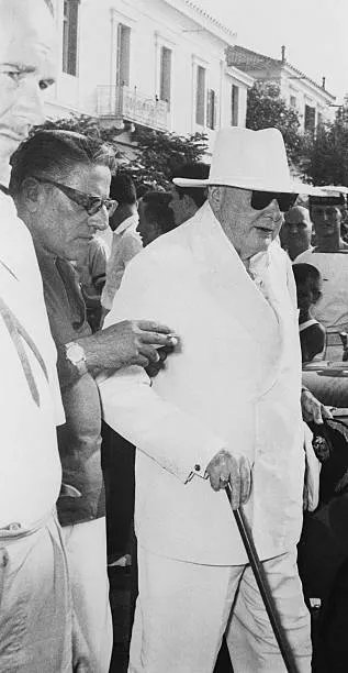 Winston Churchill with shipping magnate Aristotle Onassis. 

Taken on the 3rd August 1959 on Aegean Island.

Onassis, long an admirer of Churchill, had invited the elder statesman to join him on a yachting holiday through the Aegean Sea.