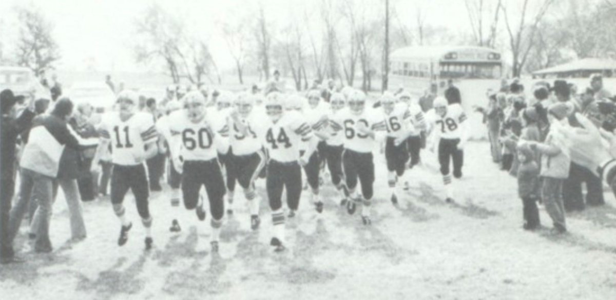 The Adams Hornets take the field (directly from a 'locker room meeting' in the bus is my guess) in 1979.