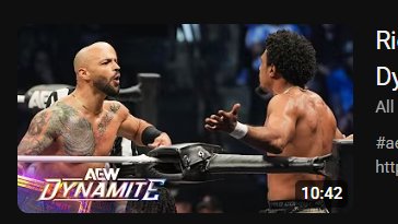 I thought something crazy happened to Ricochet's head, that's just a bald referee behind him