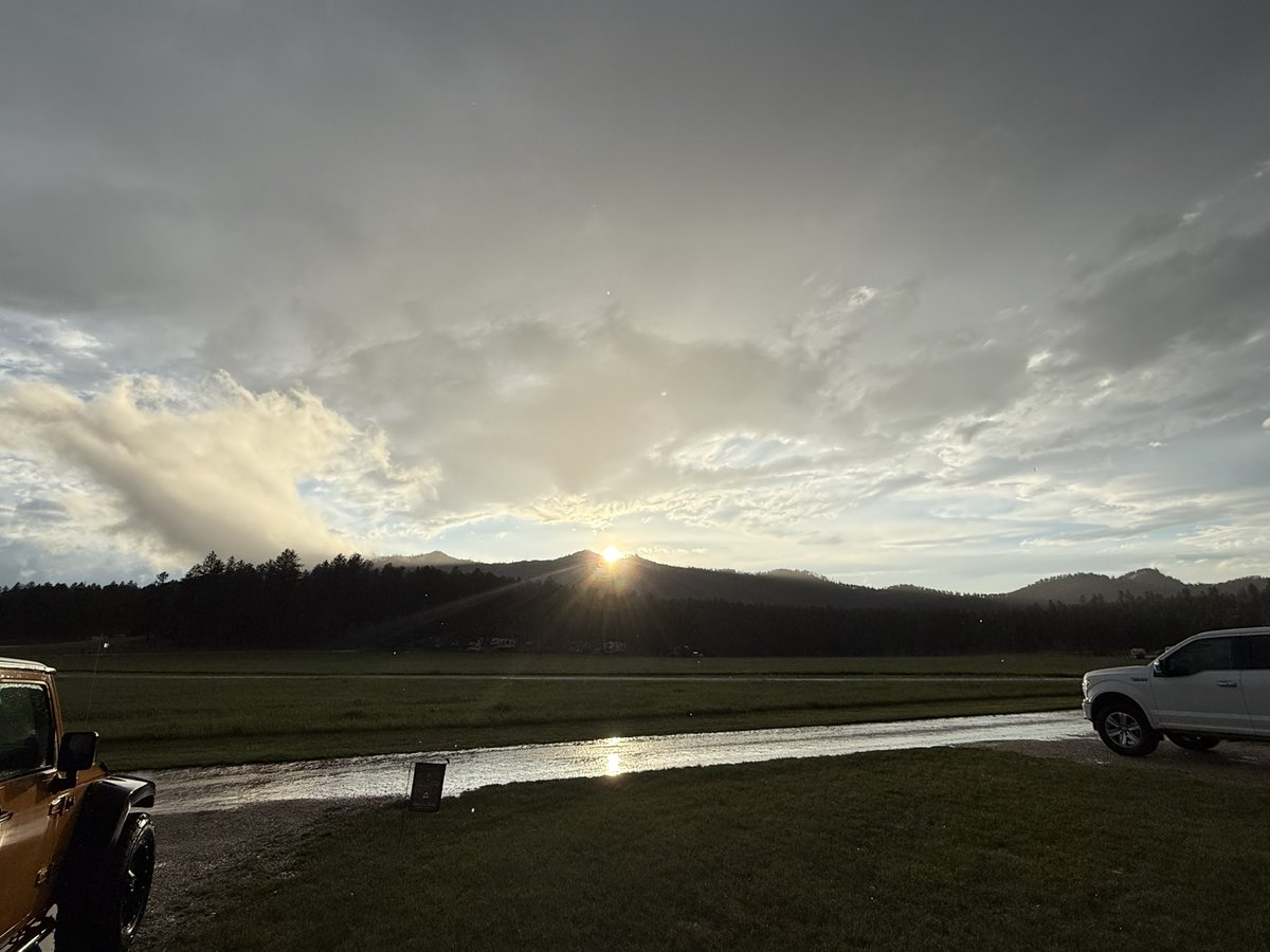 Thought I would share some of my Black Hills, South Dakota evening with you! Right after some severe storms rolled through. You can even see our "We The People" windshield cover! Oh and that rainbow too! Also, if you zoom in on the sunset picture you can see the raindrops still