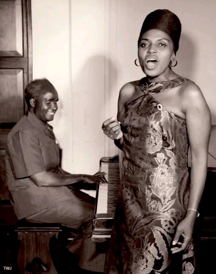 Zambia's President, Kenneth Kaunda, on the Piano as he plays along with Miriam Makeba, circa 1972.