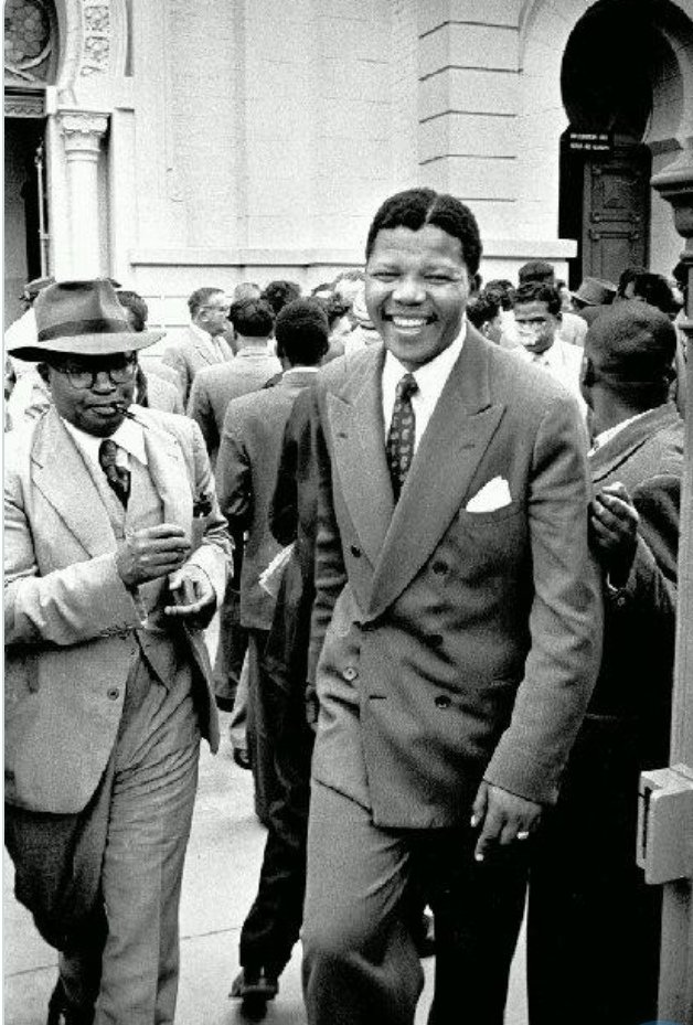 Defendants Moses Kotane and Nelson Mandela leave a courtroom in Pretoria during the Treason Trial, 1958. Picture: Jurgen Schadeberg