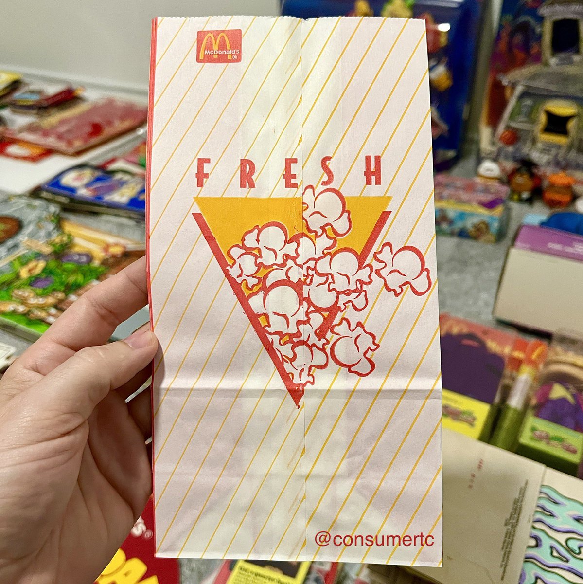 consumertc's tweet image. In the early 90s, Burger King rolled out popcorn and table service in their restaurants. Realizing it was one of the only things they HADN’T attempted, select McDonald’s locations installed popcorn machines. Here’s the bag they used in 1994!