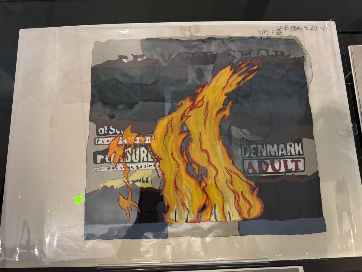 BenHalligan's tweet image. "Animated Activism" exhibition @UniversityLeeds -- recreated 1980s feminist action hot desk (with Crass making a mug cameo), and Cel artwork from "Give Us A Smile" (1983), imagining seedy Soho aflame, the night reclaimed.