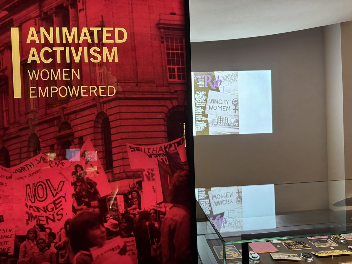BenHalligan's tweet image. "Animated Activism" exhibition @UniversityLeeds -- recreated 1980s feminist action hot desk (with Crass making a mug cameo), and Cel artwork from "Give Us A Smile" (1983), imagining seedy Soho aflame, the night reclaimed.