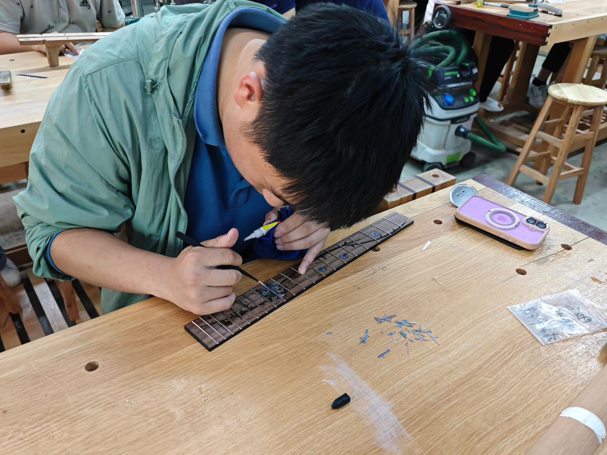 Tsinghua_Uni's tweet photo. Imagine holding a #guitar that started as a sketch and now sings in your hands. 🎸 
#StudyAtTHU with our #NextGen in the “Instrument Design &amp; Making” course. Explore the science behind sound, dive into #woodworking and design, and bring music to life through creation. https://t.co/Gq4B1yvcEm