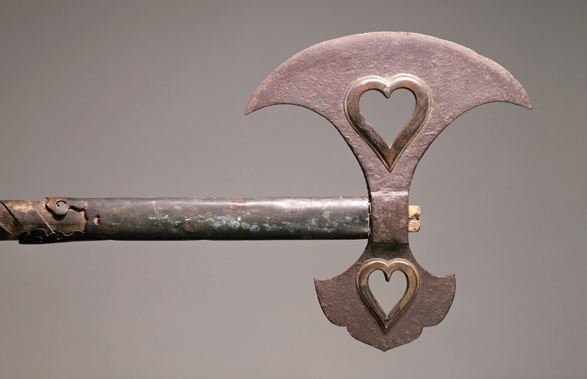 an axe with heart-shaped holes in the blade, japan, 14th century