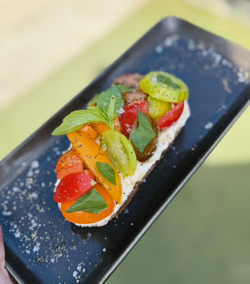 Beautiful dish to enjoy in the sunshine 🌞 Isle of Wight tomatoes and ricotta on toast.