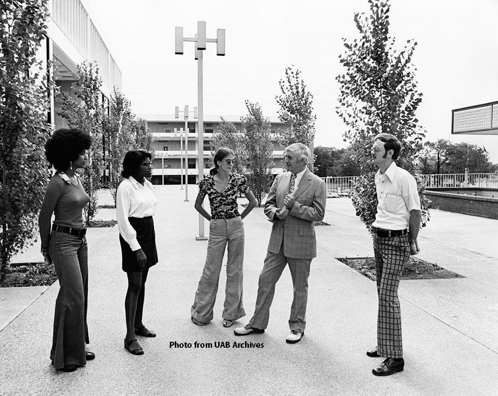 #UABThrowback
The 1970s fashion era at UAB might be one of our favorites💚

"Dr. Volker and the group enjoying the day in the plaza between the Sterne Library (left) and University College Building No. 1 [later the School of Education Building]. "