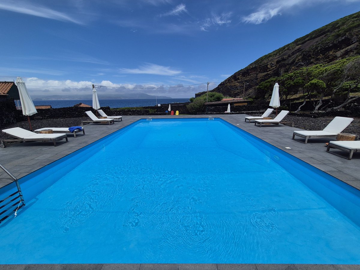 Pool day today, I'm already pink while sitting under an umbrella with suntan lotion on 😂  #azores #pico