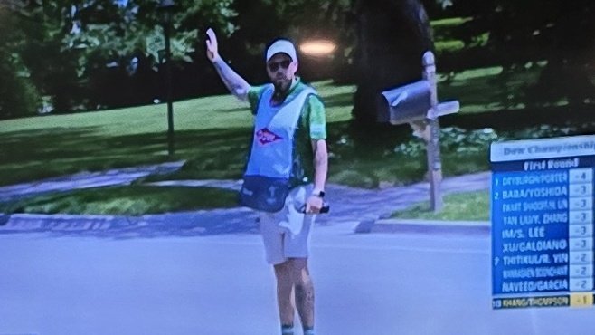 Just a caddie stopping traffic. You know, normal Thursday stuff.