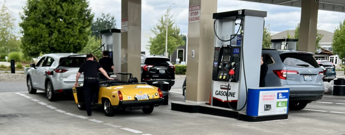 NancyPettit's tweet photo. MG Midget getting gassed @Costco #tinycar $3.84/gallon today https://t.co/FzJzczCH1N