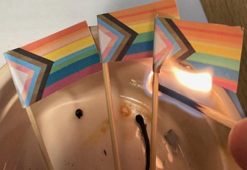 LadySoLucky's tweet photo. #EndPride This home burning - Health and safety addressed, was inspired by @RadfemBeat who did one and posted it over a yr ago, I had to print and cut out and glue them to cocktail sticks. It was hard lighting them and taking oics with the other hand https://t.co/HsgYh4qr2U