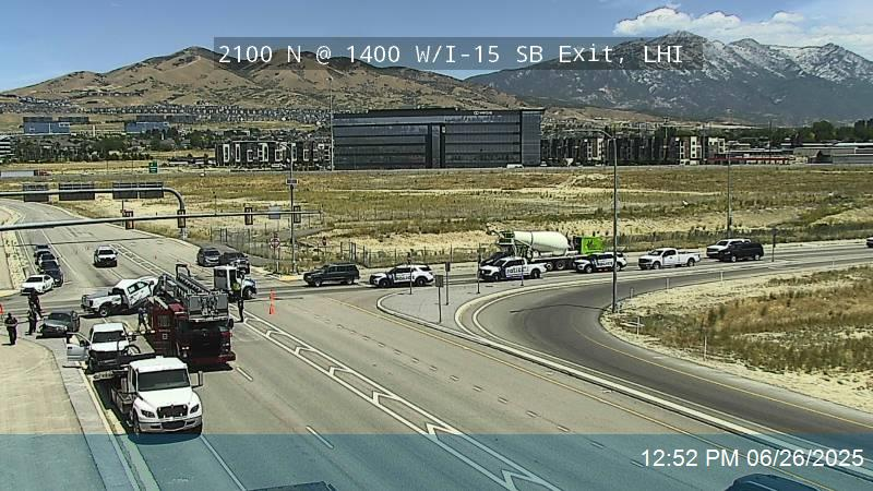 This is a current look at the multi-vehicle crash in Lehi at 2100 N and 1400 W. A pickup truck wrapped itself around the light pole at the NW corner. Right lanes blocked to go WB on 2100 N. USE CAUTION <a href="/KSLTraffic/">KSL Traffic Updates</a>