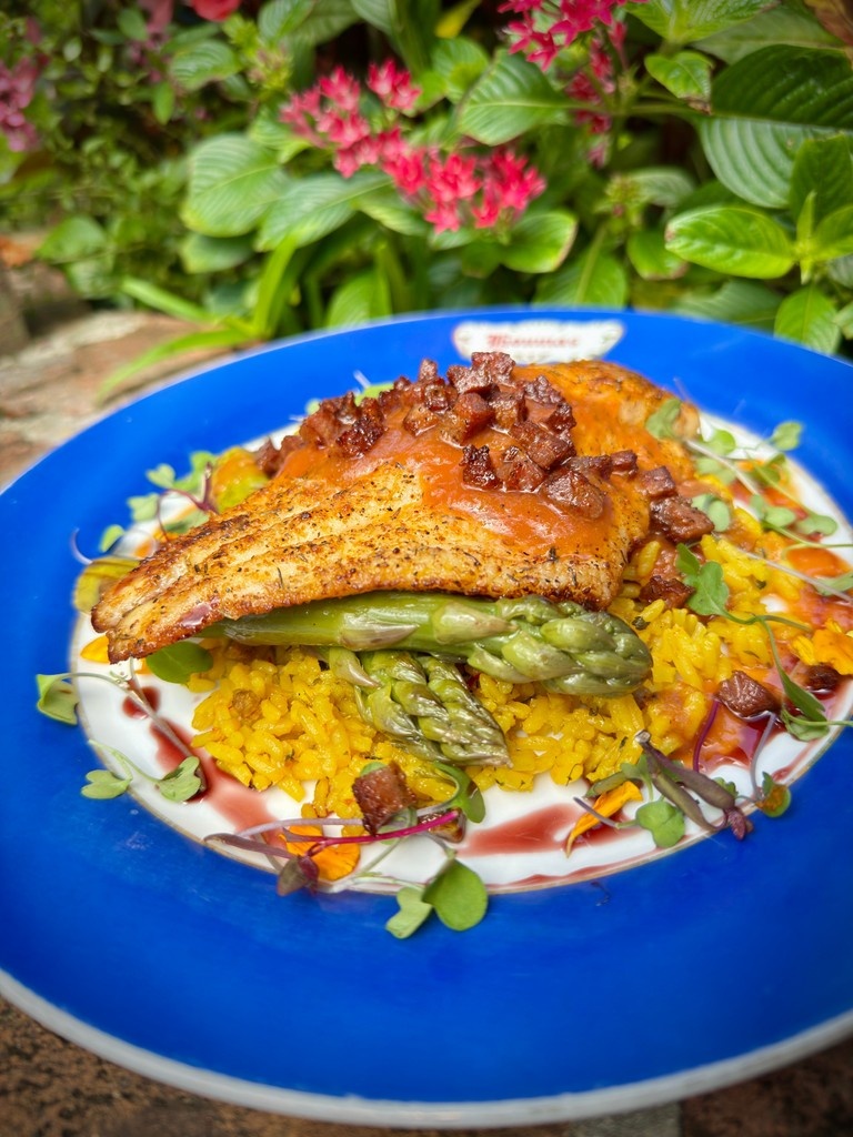 Tomorrow — Friday, June 27, 2025 — we’re featuring a special!
Delta Catfish
Baked catfish fillet served over andouille saffron rice, topped with crispy andouille, asparagus, and a vibrant tomato coulis.

Don’t miss it!