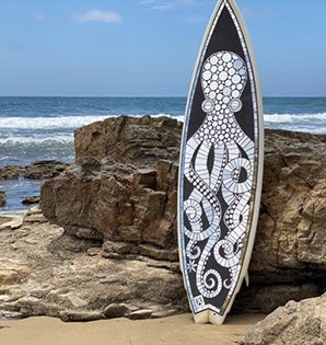 Anne Marie Price, mosaic artist based in southern California, who among other materials, creates her work on surfboards #WomensArt