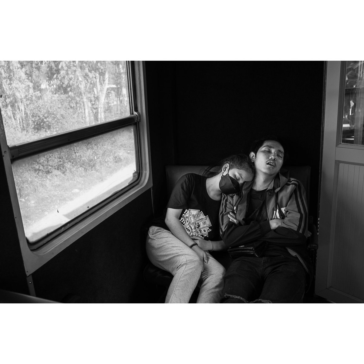 Thinking about a series of 10 small booklets. One of them could be "It Takes Two".
CAMBODIA, Takeo. 24/01/2023: Passengers sleeping during on the Sihanoukville-Phnom Penh train.