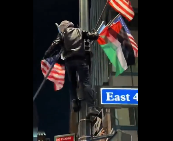 GrandsRising's tweet photo. @AOC THIS is why Americans oppose Islamist who come here to get political power. Why would they remove the American flag to celebrate? https://t.co/f0plxnspCO
