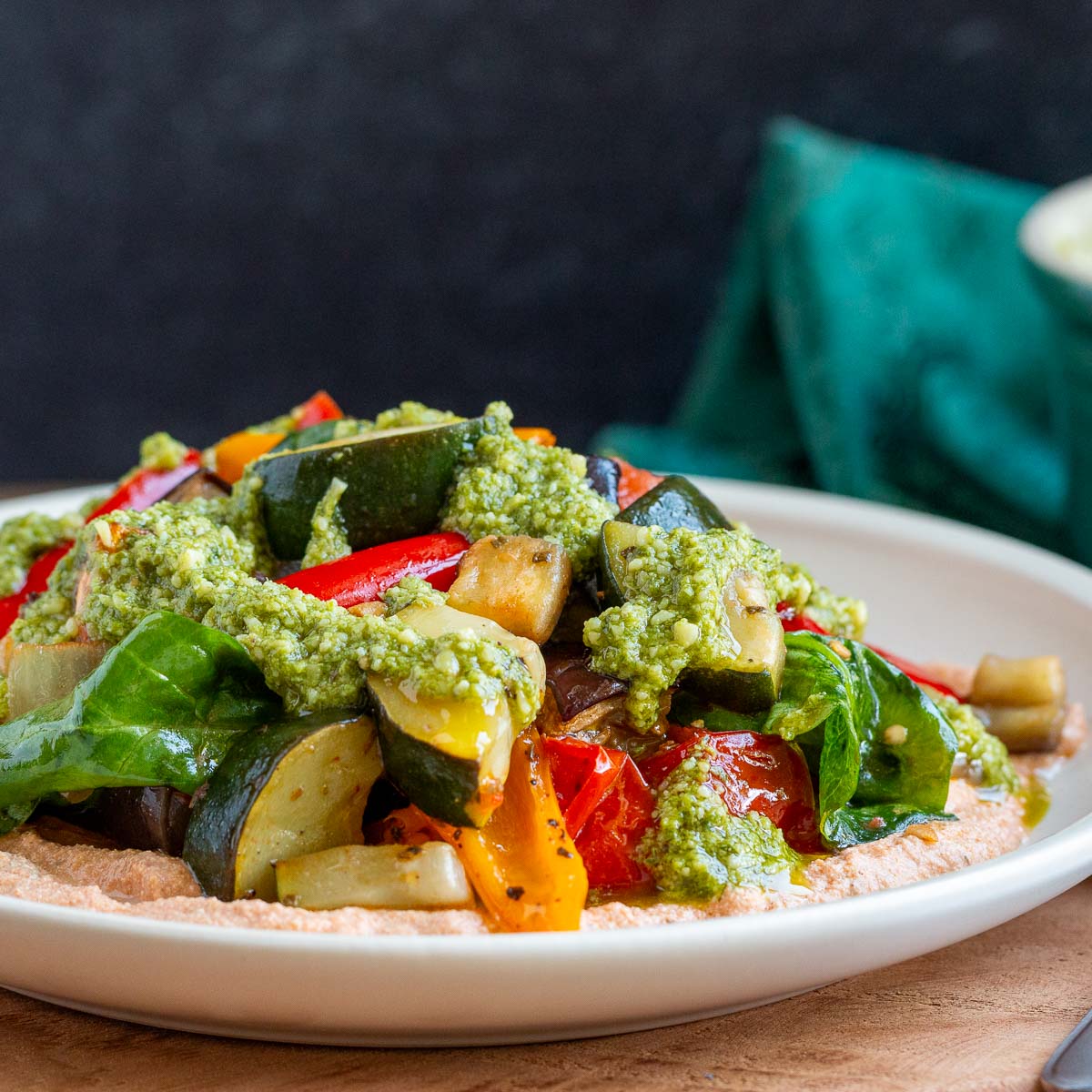 Delicious roasted Italian veggies make the perfect side or appetizer! Crisp, garlicky, and sweet, they’re paired with creamy tofu whip and drizzled with basil pesto. Serve with toasted crostini for a flavor explosion! #Vegetable  #HealthyEating #PlantBased