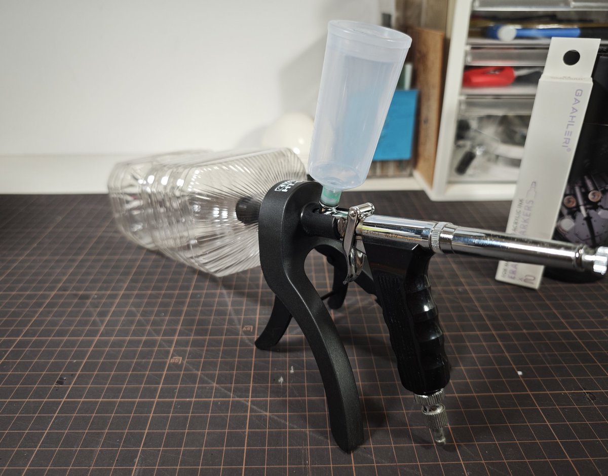 I totally forgot about this goofy little guy. It's the Wave HT-056Airbrush Holder and Cleaning Pot adaptor.

It's a wonderful idea that absolutely doesn't work...