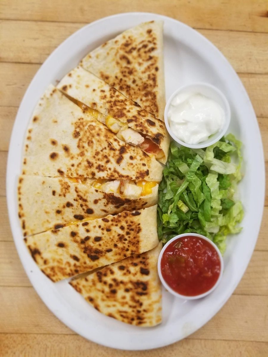 Dive into our chicken quesadillas—warm flour tortillas packed with juicy chicken, gooey mozzarella, and a kick of salsa, romano, and cheddar. Served with a side of salsa and sour cream! 
#supportlocal #QuesadillaLove #foodie