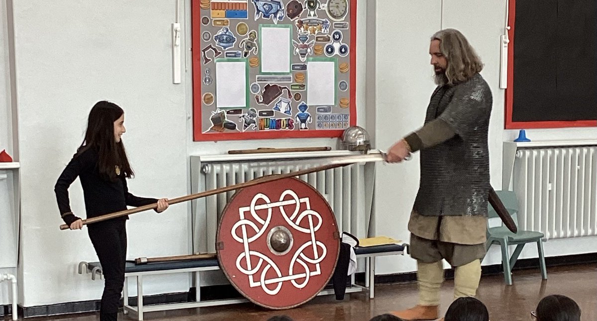 BVCSchool's tweet image. Year 5 had a Norse visitor from Portals to the Past.  Bjorn taught us the Viking story.  Here is one of our students learning why spears were effective battle weapons for the Vikings! @BVCSchool