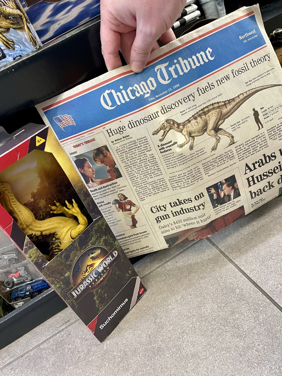 At Midway airport with a stack of stuff from my parents basement in my carryon, including this 27 y.o. article announcing Suchomimus, and what do I see in Hudson News? Such a wild feeling to see a Jurassic Park toy of a new species that you chiseled out of the rock. #FossilFriday