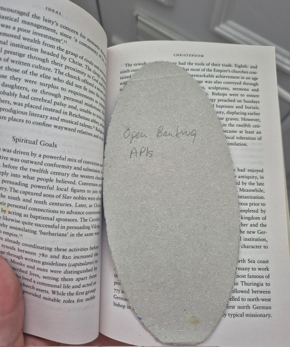 got a book off of eBay that's been shipped with a kleenex lid bookmark with "open banking APIs" on the back