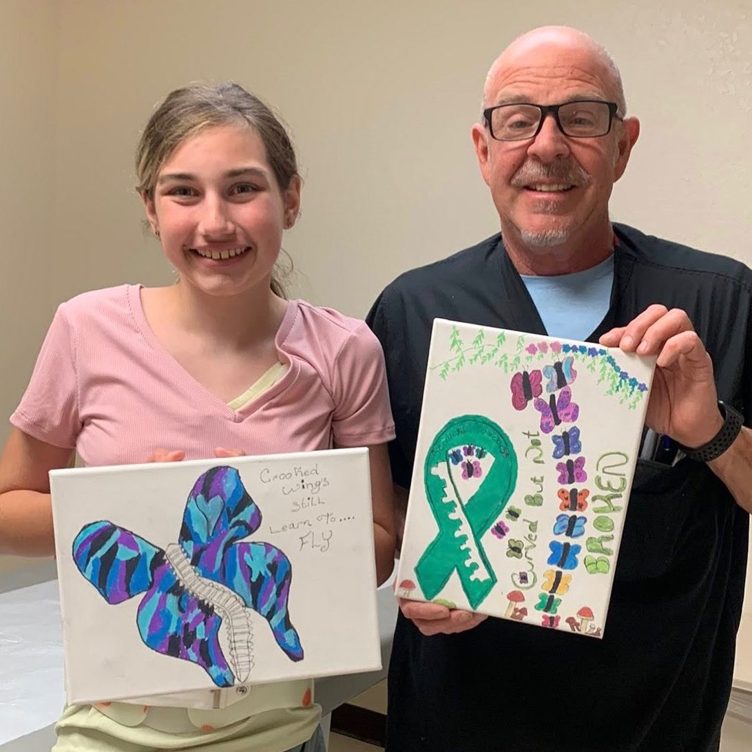 ShrinersFlorida's tweet image. Thanks to the customized scoliosis brace she receives from @shrinershosp, Madison remains actively "on the move" this summer. 👟☀️During her last POPS appointment, she shared some artwork she created in honor of #ScoliosisAwarenessMonth 💚 Read her story: tinyurl.com/y3nj7545