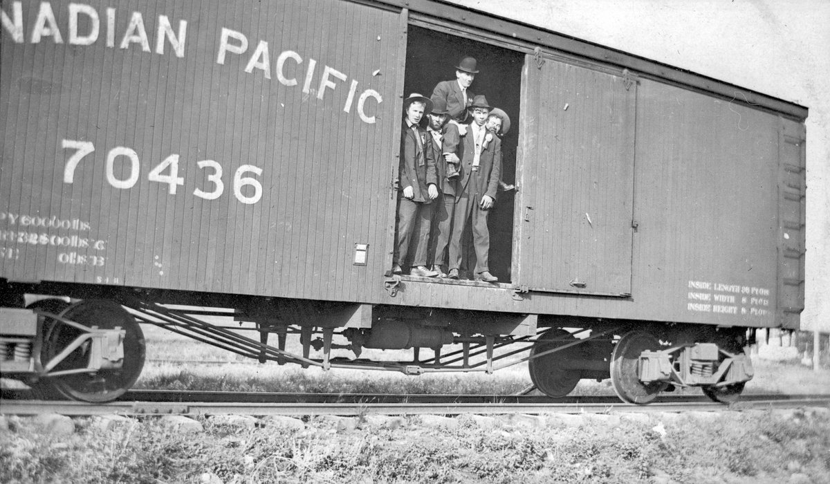 Unemployed men inside Canadian Pacific Railways boxcar (riding the rails), 1930s (A15151).