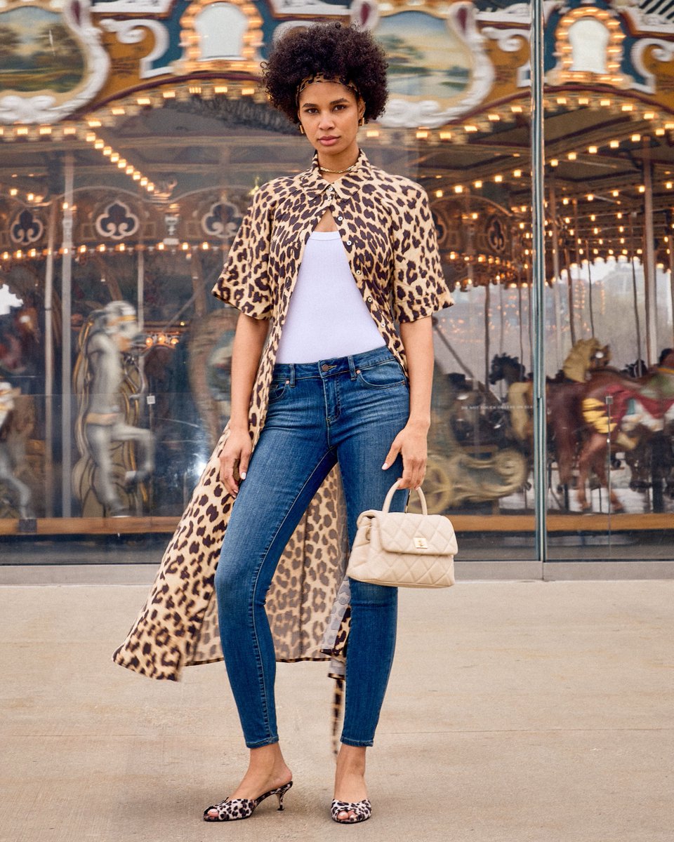 Signature print, modern silhouette: leopard owns the moment.